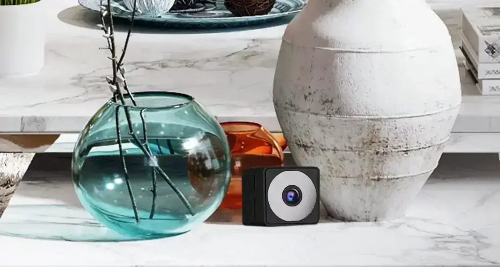 A Dealeez mini spy camera placed on a table