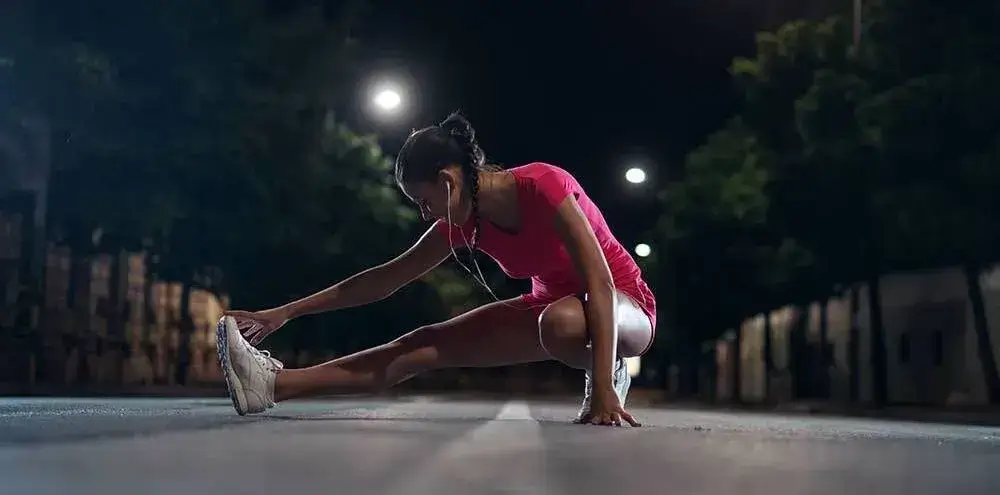 A jogger doing stretches